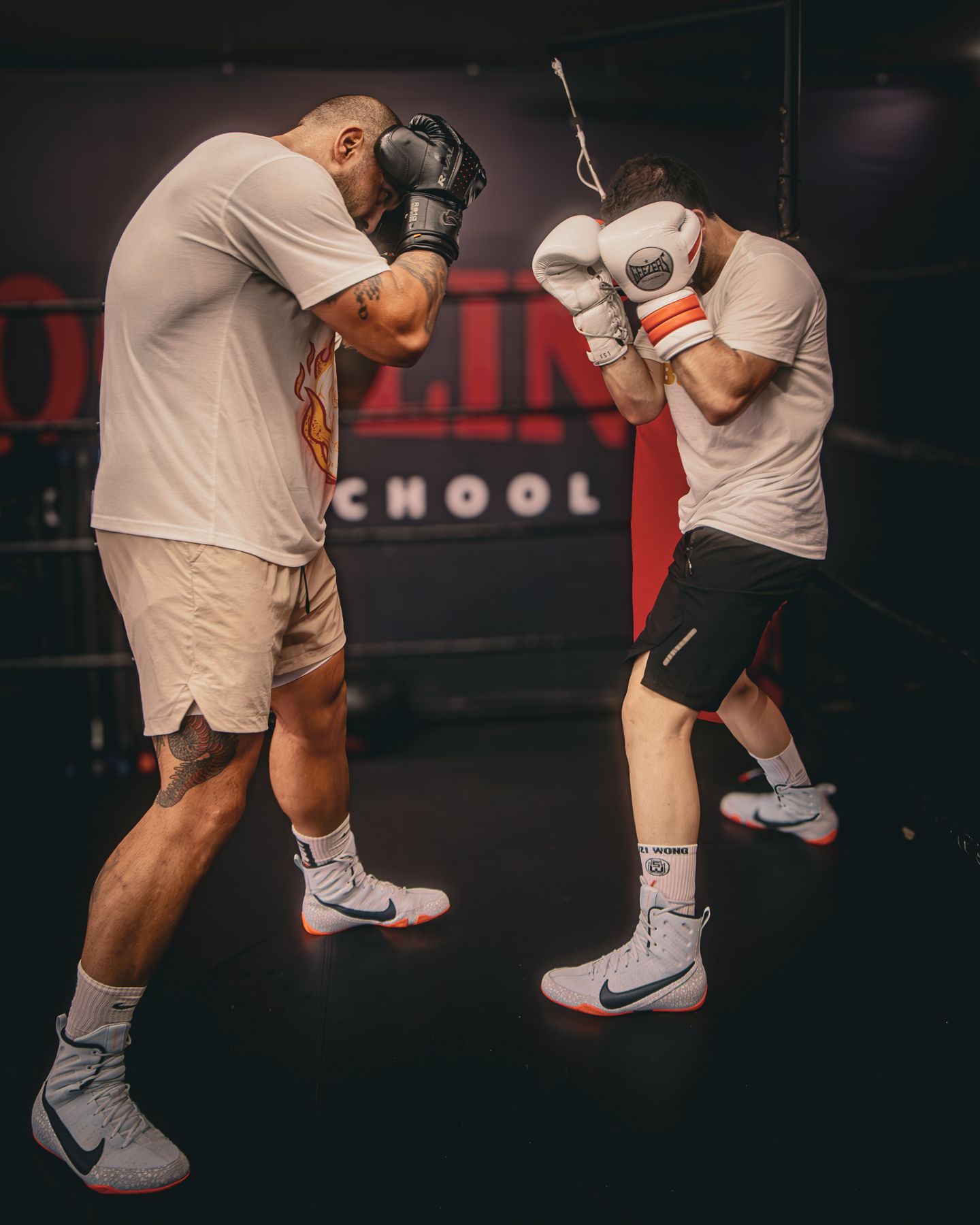 Two boxers trading punches in the gym